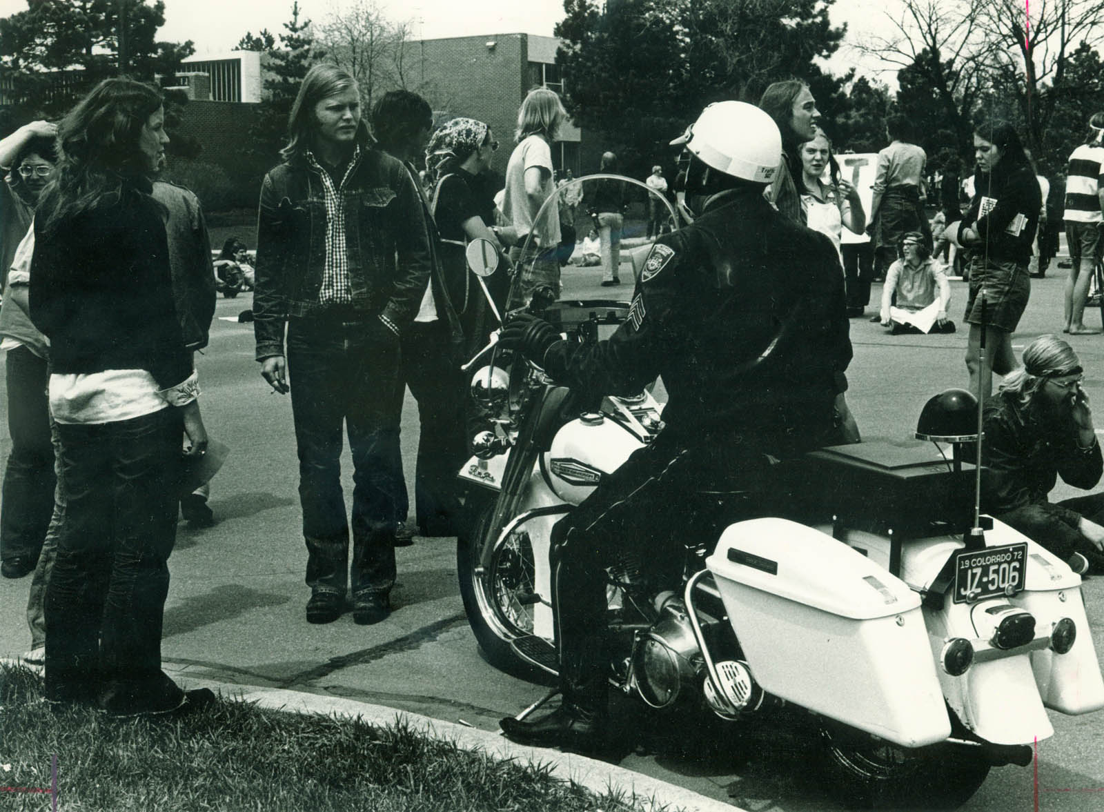 Police officer engages with student Vietnam War protestors, 1972.
